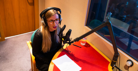 Lady recording podcast in Red Facilities' studio in Leith